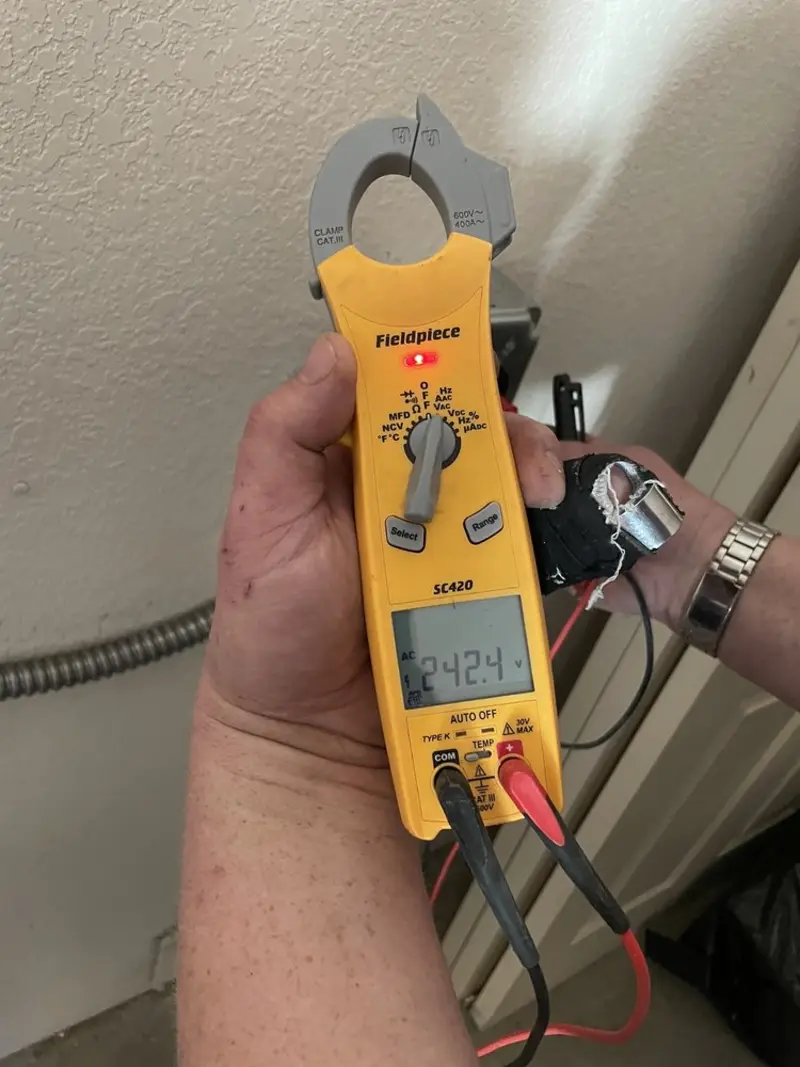 Voltage testing with clamp meter during Recessed Lighting Installation in Kingsland